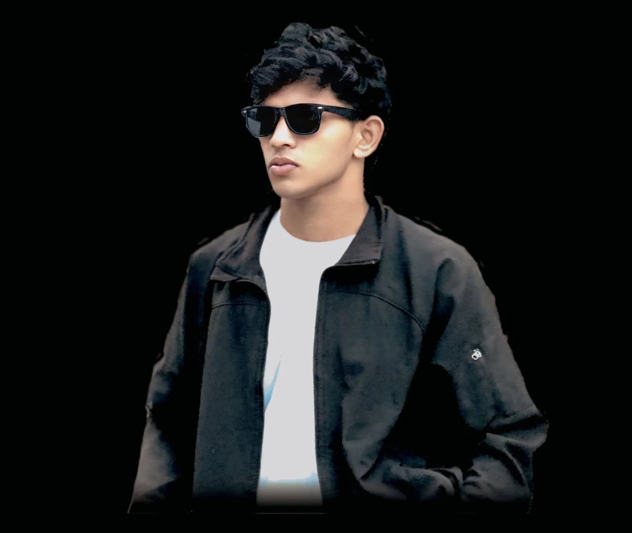 "Image of a young professional, potentially the best digital marketing freelancer in Malappuram, wearing a black jacket and sunglasses against a dark background."