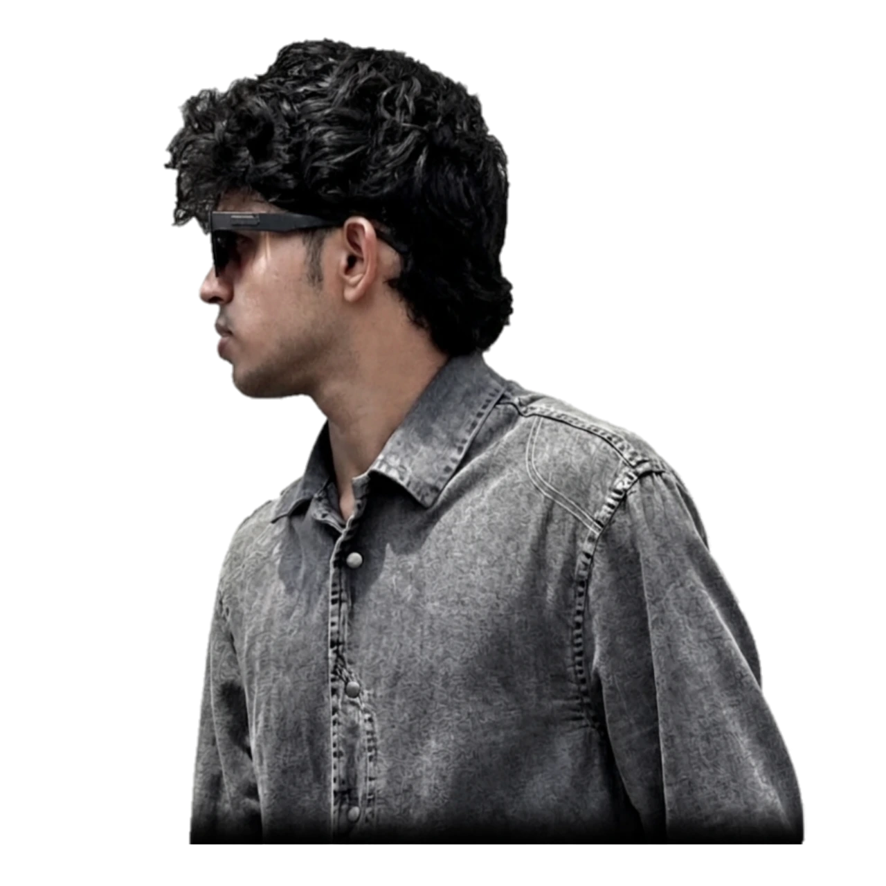 "Image of a young professional, potentially the best digital marketing freelancer in Malappuram, wearing a black jacket and sunglasses against a dark background."